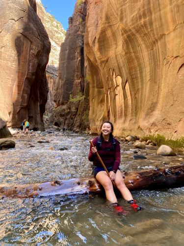 Chelsea Yu hiking at The Narrows in Zion National Park